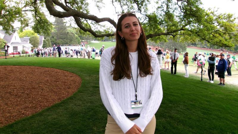 Gabby Herzig smiles on the golf course.